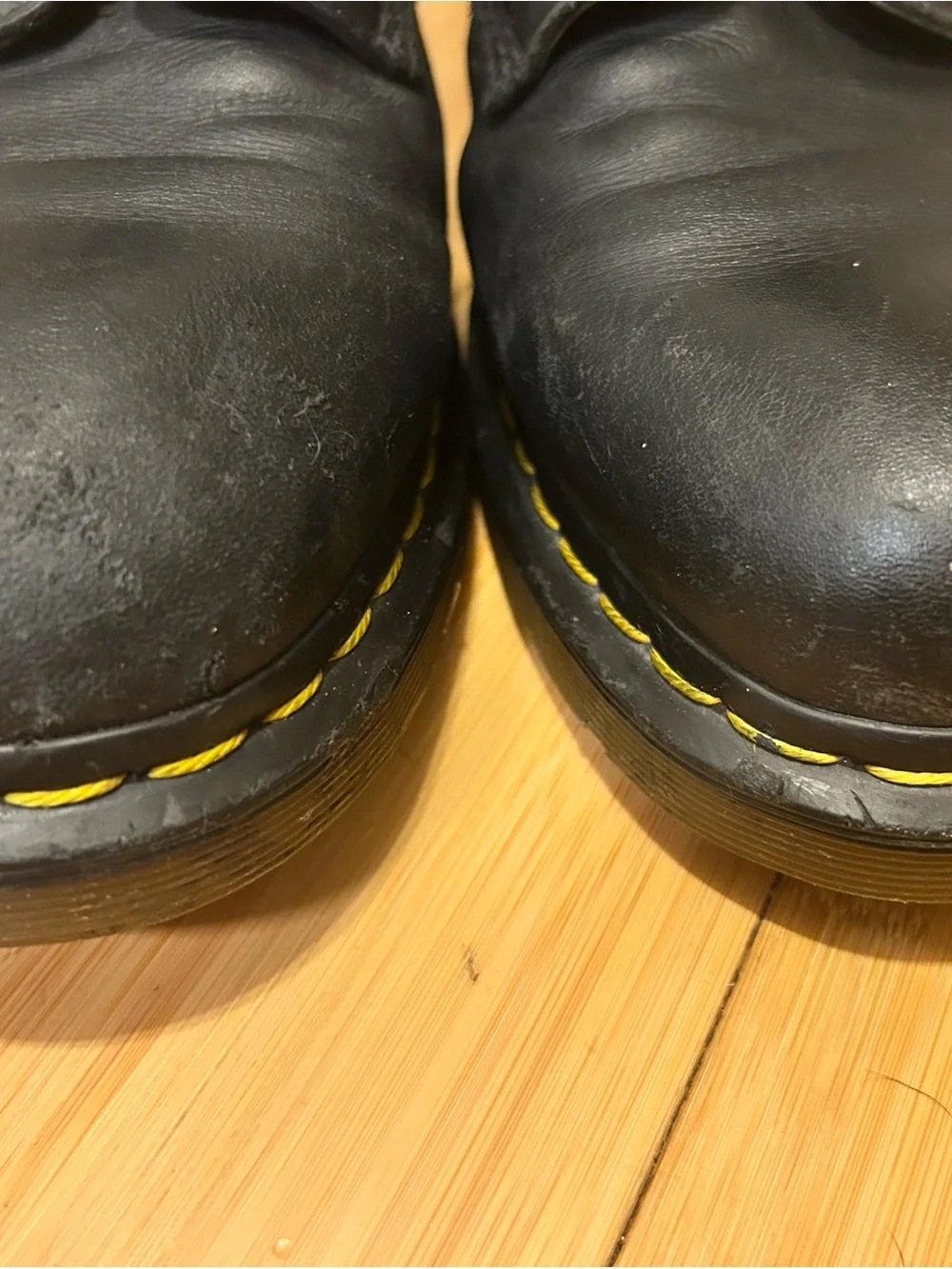 Dr. Martens Black Leather 8-Eye Lace-Up Boots with Yellow Stitching